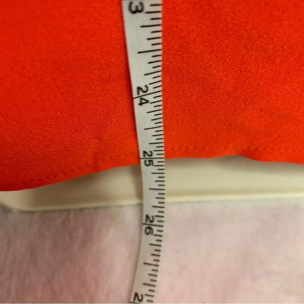 Rachel Zoe bright orange blouse size Small bold seam down the front